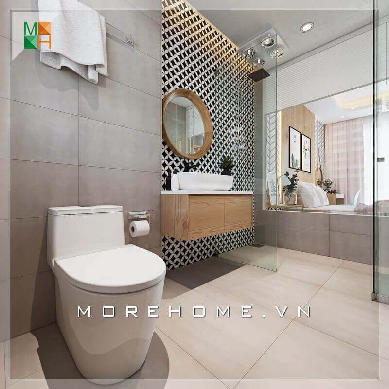 Không gian tắm sang trọng được trang bị gương soi lớn hình chữ nhật và gương tròn hiện đại.